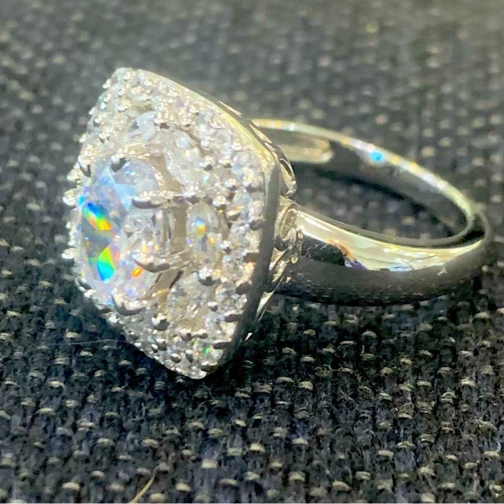 Gorgeous engagement or right hand ring . Size 7 . Rhodium plated. Cluster silver